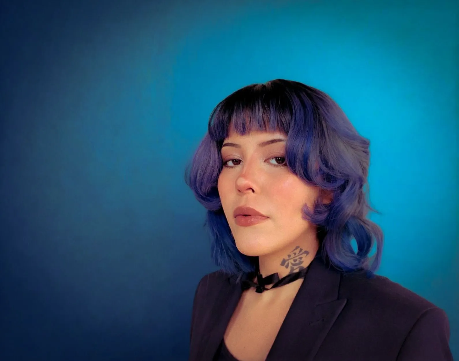 A bird sitting on a nest of eggs.